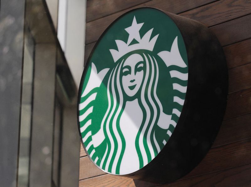 © Reuters. FILE PHOTO: A view shows the logo of an American coffee company Starbucks on a wall outside in a coffee shop in Mexico City, Mexico June 17, 2024. REUTERS/Henry Romero/File Photo